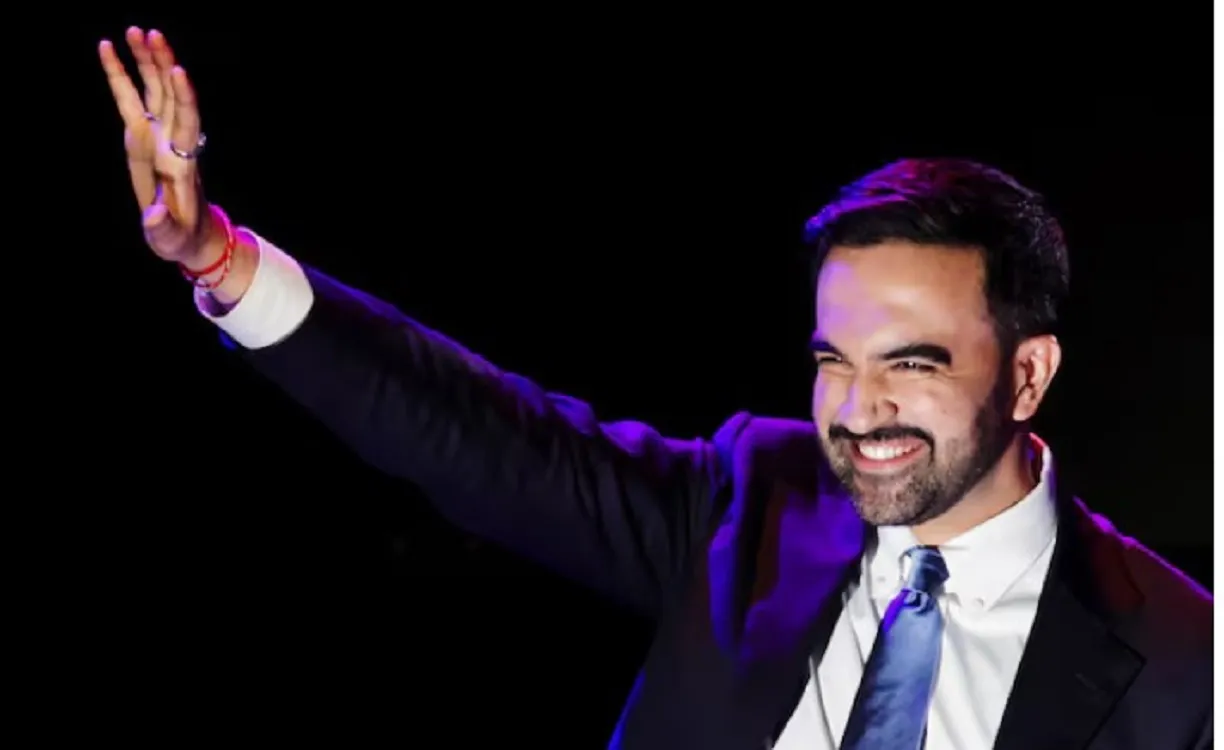 Democratic candidate for New York City mayor Zohran Mamdani waves on stage after winning the race. REUTERS