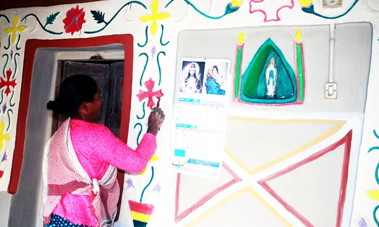 Christian Santal villages in Phulbari, Dinajpur, celebrate Christmas with traditional Alpana art and grand church festivities.