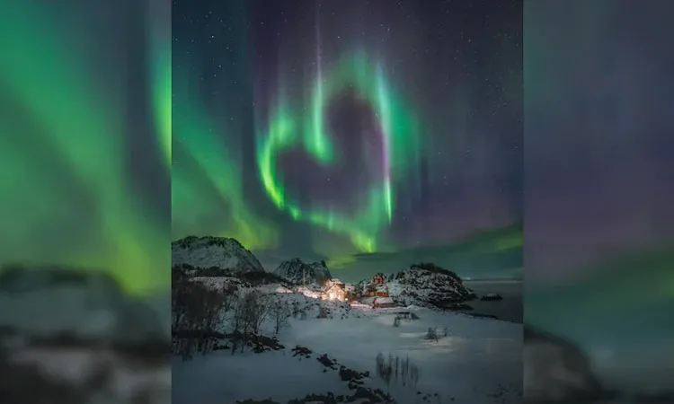 A Norwegian photographer captures a rare heart-shaped Northern Lights display.