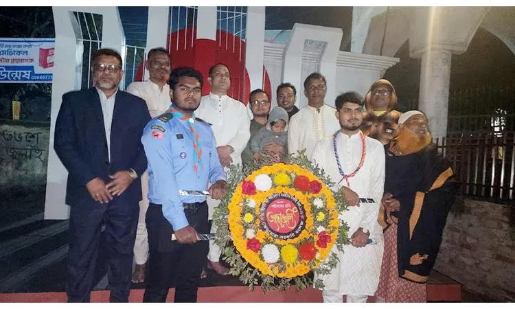 Paying homage to the martyrs by laying flowers at the Shaheed Minar in Bheramara on the first hour of Ekushey