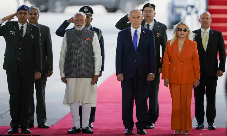 India's Prime Minister Narendra Modi, Israel's Prime Minister Benjamin Netanyahu and Netanyahu's wife Sara Netanyahu attend a welcome ceremony upon Modi's arrival at Ben Gurion International Airport in Lod, near Tel Aviv, Israel.