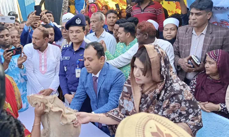Shama Obaed Islam distributing essential food for poor people in Faridpur.