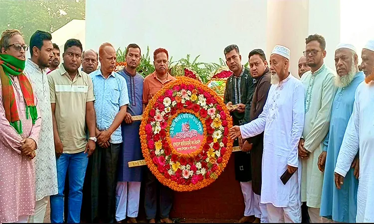 Leaders and activists marched through the town, chanting slogans, and gathered at the local memorial.
