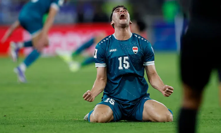 Iraq's Zaid Ismail celebrates after the match as they qualify for FIFA World Cup