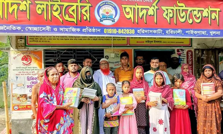 Books Distributed to Needy Students in Paikgachha