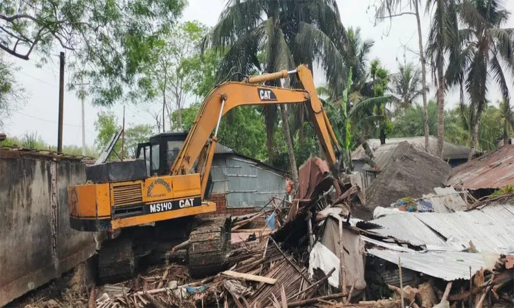 Illegal structures demolished on BWDB land in Paikgachha amid ownership dispute