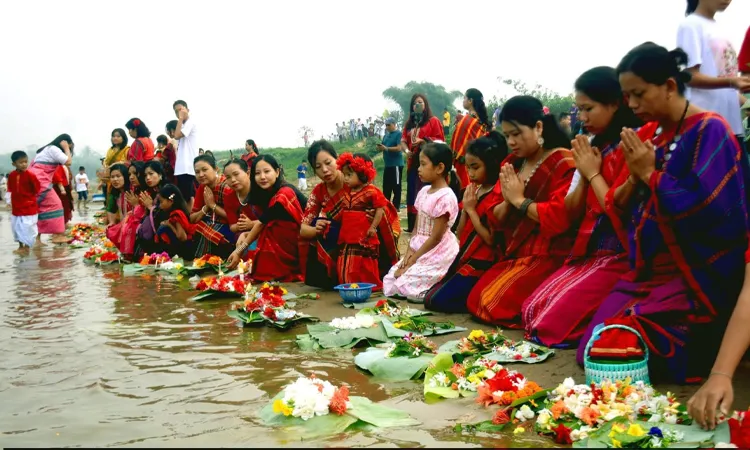 The three-day Biju festival starts in Khagrachari as the Chakma community floats flowers in the Chengi river to welcome the New Year and pray for world peace.