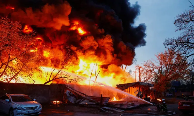 Firefighters work at the site of a missile strike in Kyiv, Ukraine, amid a Russian attack