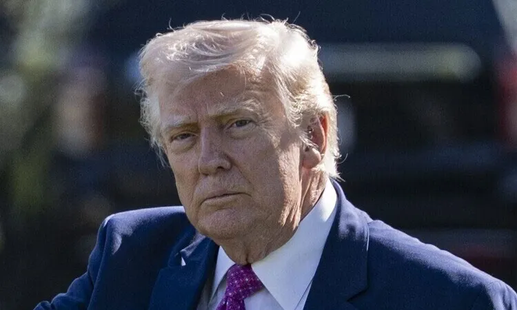 U.S. President Donald Trump speaks with reporters