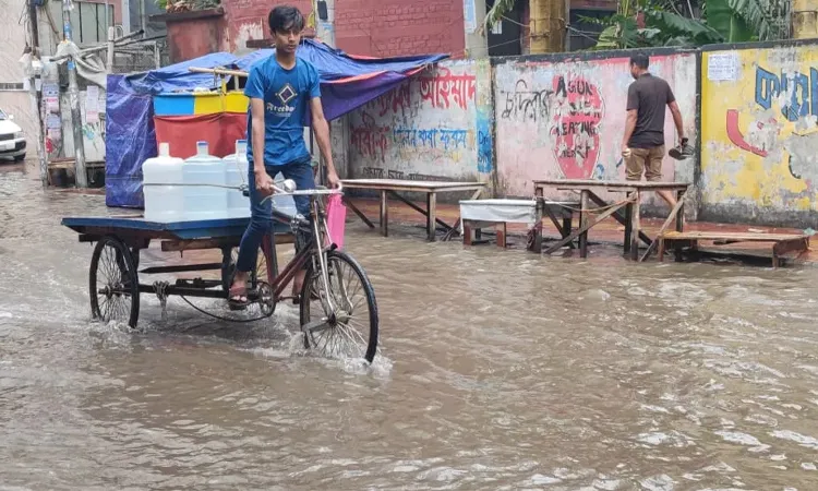 A sudden two-hour downpour early Friday morning left major areas of Dhaka waterlogged.