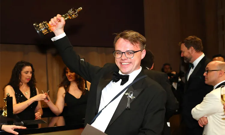 Pavel Talankin hoists his Oscar in March
