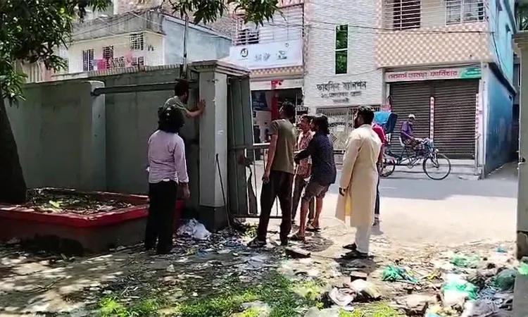 Removal of tin fence and iron gate from former minister Amir Hossain Amu's abandoned home by anti-discrimination student activists on May 6, 2026.