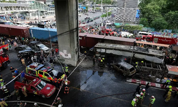 A cargo train struck a passenger bus at a Bangkok railway crossing.