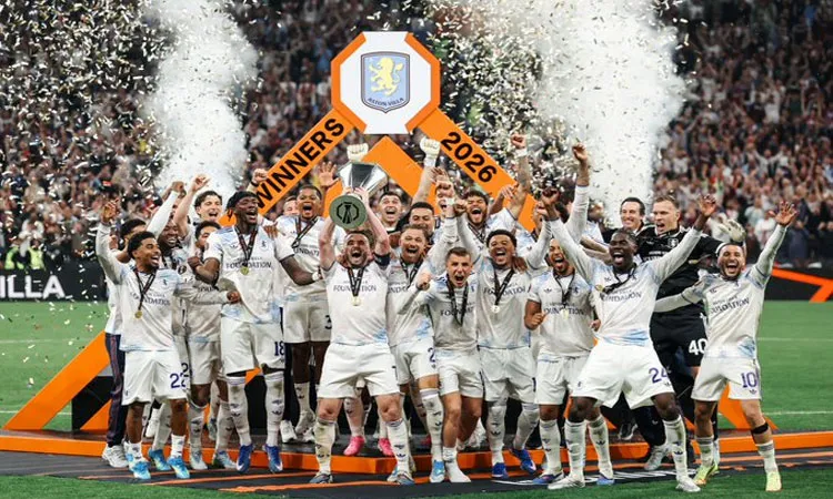 Aston Villa's John McGinn lifts the trophy as he celebrates with teammates after winning the UEFA Europa League.