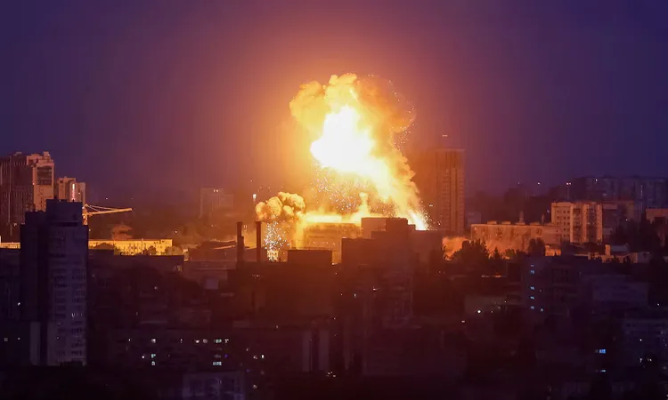 An explosion lights up the sky over the city during a Russian missile and drone strike, amid Russia's attack on Ukraine, in Kyiv
