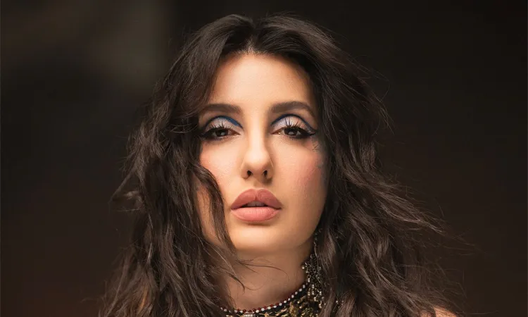 Nora Fatehi took to social media to flaunt her electric blue graphic liner look.
