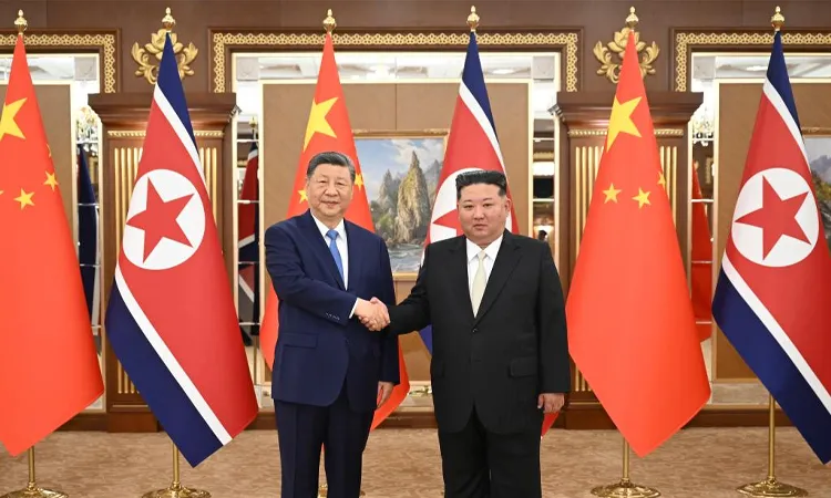 Xi Jinping shakes hands with Kim Jong Un at the Kumsusan State Guesthouse in Pyongyang, DPRK.