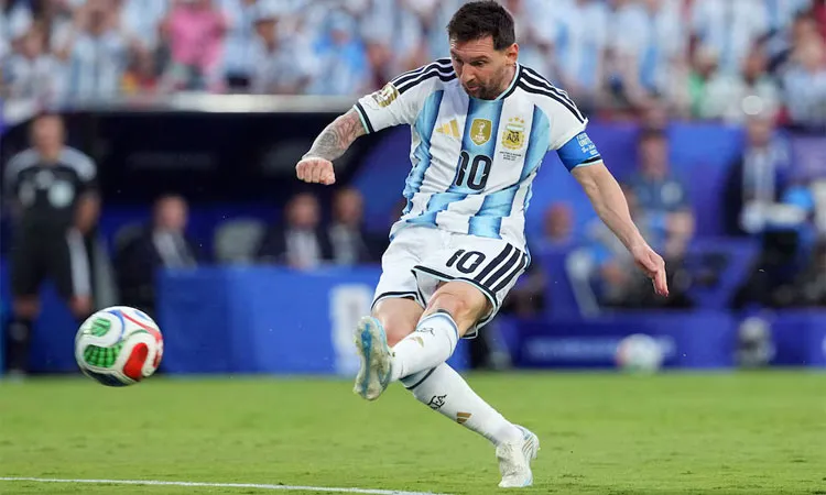Argentina's Lionel Messi scores their first goal.