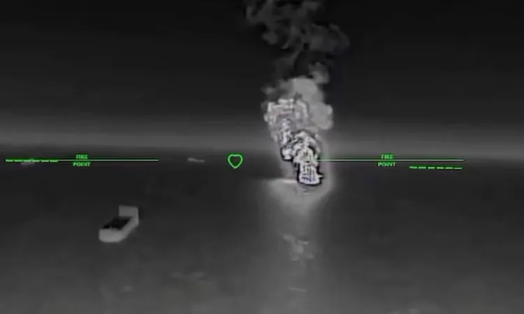 Smoke rises after what the Ukranian authorities say was during a strike as Ukrainian UAVs hit a Russian dark fleet tanker at a location given as Sea of Azov.