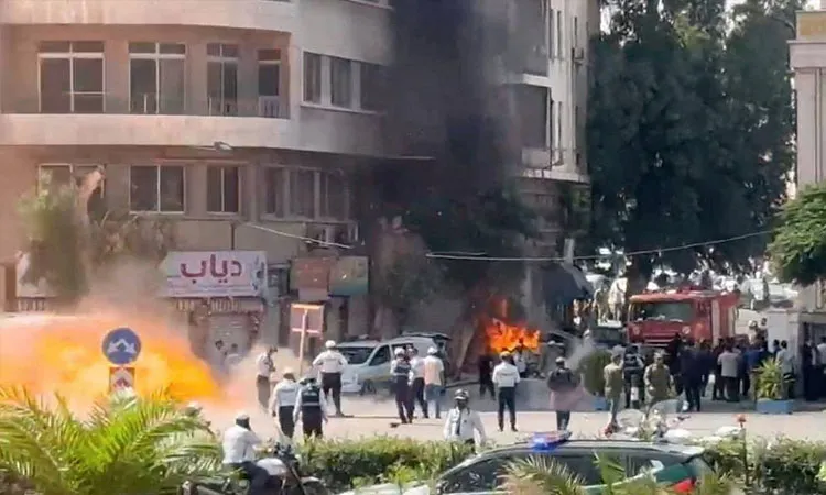 The blasts occurred near the Tourism Ministry building and a hotel where French President Emmanuel Macron is staying during his current visit to Damascus.