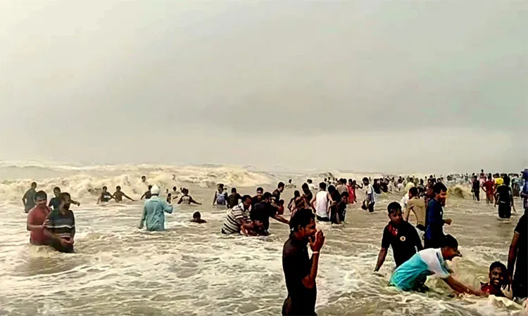 Despite warning signal 3 and red flags at Cox's Bazar reckless tourists are ignoring lifeguards and bathing in rough seas.