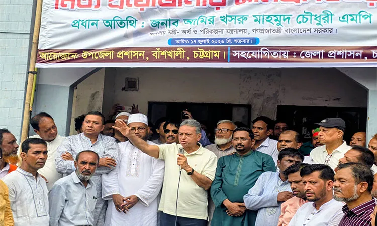 Finance Minister Amir Khasru Mahmud Chowdhury distributing relief among flood victims in Bashkhali .