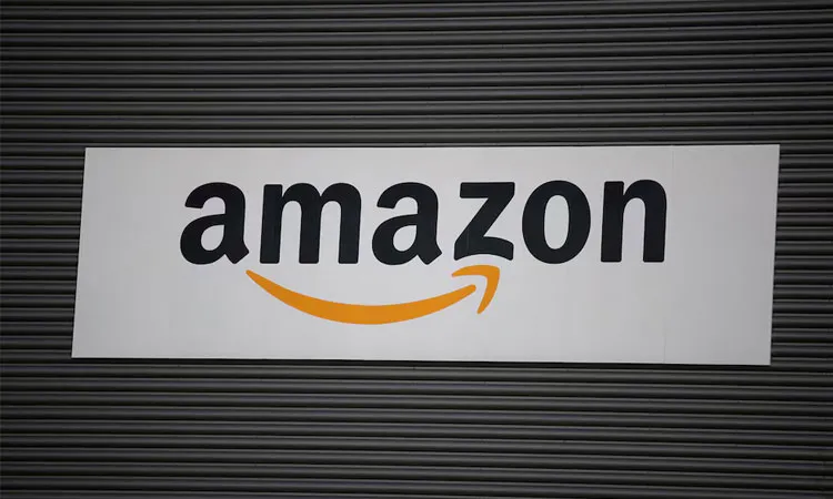 Amazon logo outside an Amazon warehouse in Manchester, Britain.