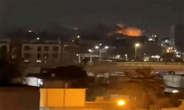 Smoke and flames rise after an explosion in Bandar Abbas in Iran’s Hormozgan province before dawn on Friday.