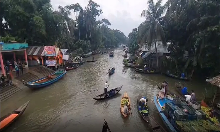The famous Bhimruli floating market with fresh produce and thousands of visitors daily.