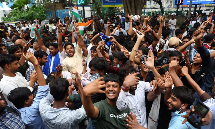 Supporters of India's Cockroach Janta Party (CJP) celebrate after India’s Education Minister Dharmendra Pradhan resigned.