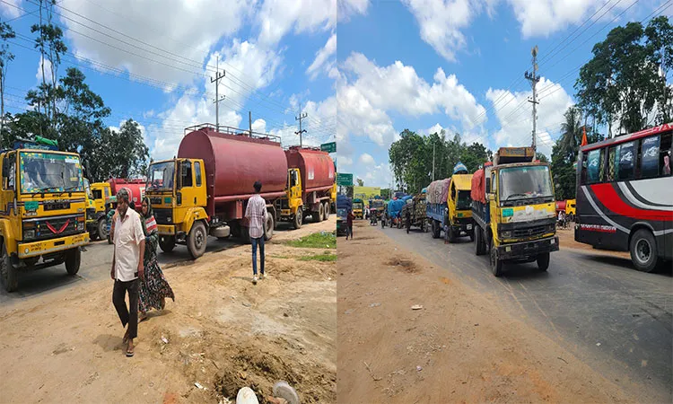 Truck workers blocked the road in Phulbari, Dinajpur on Saturday afternoon, centering on a fight between a truck driver and a businessman.