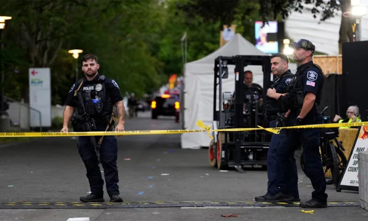 Police respond to a shooting at Seattle Center during the Bite of Seattle food festival Sunday, July 26, 2026, in Seattle, Wash.
