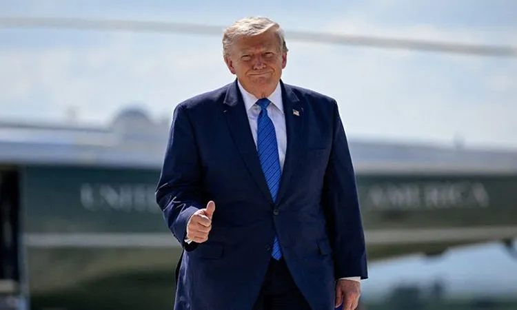 US President Donald Trump gives thumbs-up as he walks from Marine One to board Air Force One, following a cabinet meeting at Camp David, at Hagerstown Regional Airport in Hagerstown, Maryland, U.S., July 31, 2026.