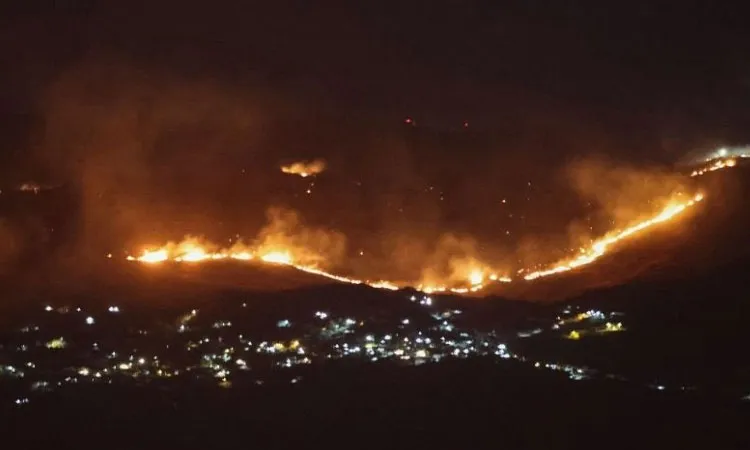 Forest fires sweep through the outskirts of the southern village of Kfar Shouba as a result of Israeli shelling that targeted the area, as seen from the southern Lebanese area of Marjayoun on 5 August 2026.