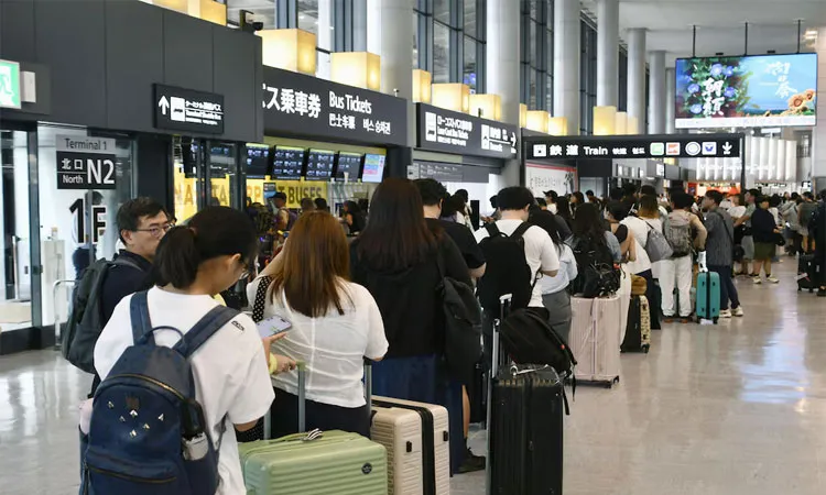 Around 7,000 people were left stranded overnight at Narita, one of Tokyo's two main airports, as the rain cut transport services linking to the airport on Thursday.