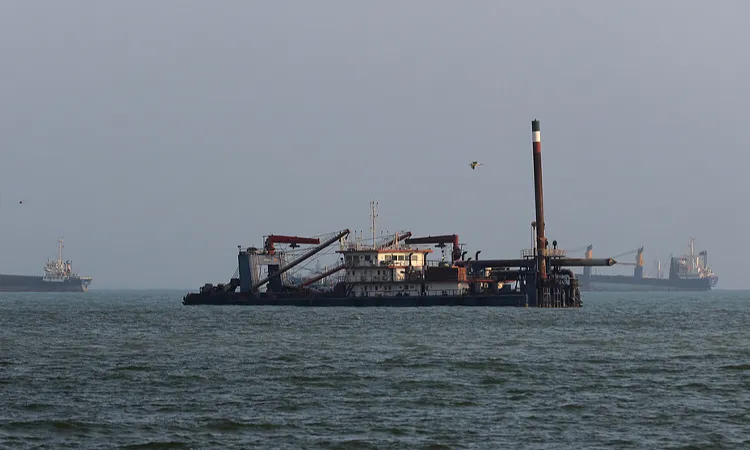 Ships are anchored in the Strait of Hormuz off the coast of Bandar Abbas, Iran.