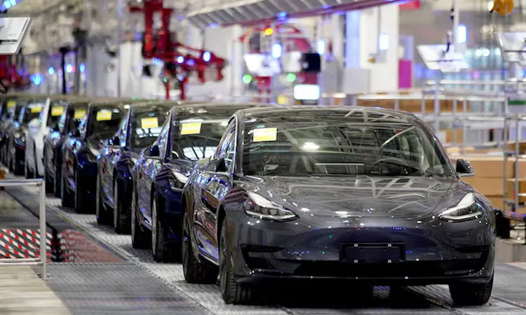 Tesla China-made Model 3 vehicles are seen during a delivery event at its factory in Shanghai, China