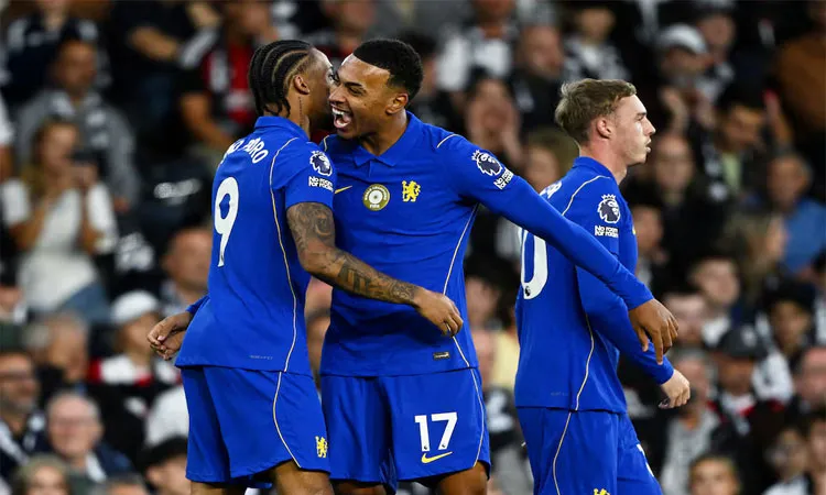 Chelsea's Joao Pedro celebrates scoring their first goal with Morgan Rogers and Cole Palmer.