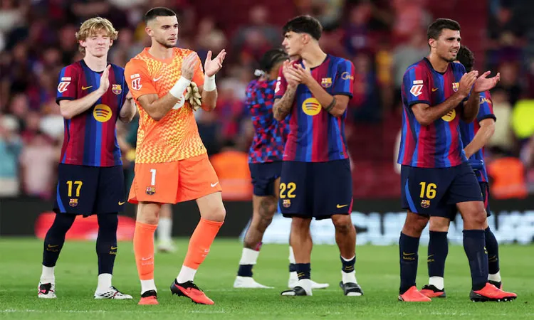 Barcelona's Anthony Gordon, Joan Garcia, Marc Bernal and Rodri celebrate after the match.