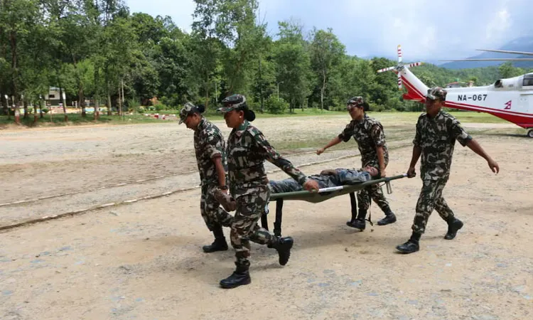 A survivor rescued by Nepalese Army following a flash flood