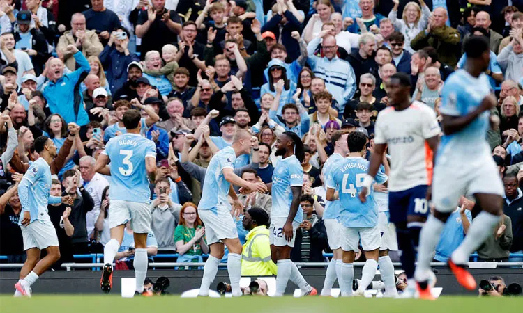 Manchester City's Erling Haaland celebrates scoring their first goal with Antoine Semenyo Action.