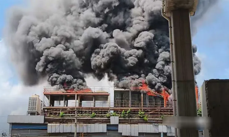 Thick black smoke into the sky and drawing attention from a distance.