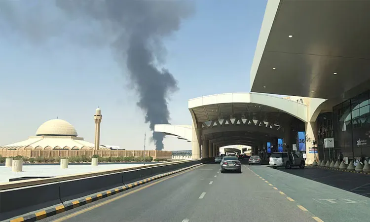 Large plume of black smoke rises from the fuel storage depot at King Khalid International Airport in Riyadh, Saudi Arabia:
