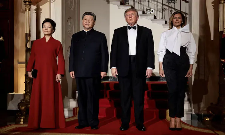 US President Donald Trump and first lady Melania Trump pose with Chinese President Xi Jinping and his wife, Peng Liyuan at the White House ahead of a state dinner in Washington.