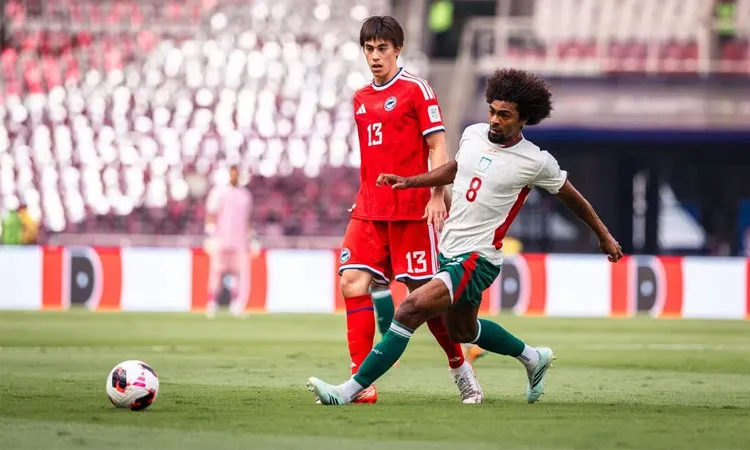 Bangladesh midfielder Hamza Choudhury (right) competing for the ball with Singapore’s Harhys Stewart.