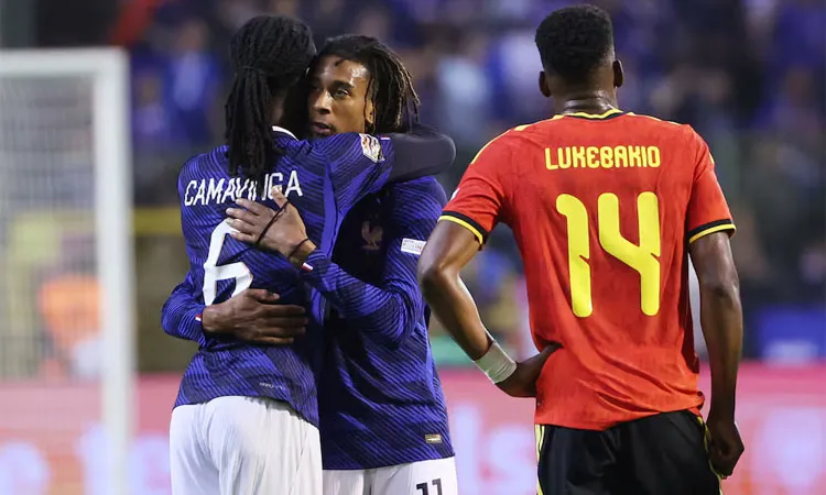 France's Michael Olise and Eduardo Camavinga celebrate after the match