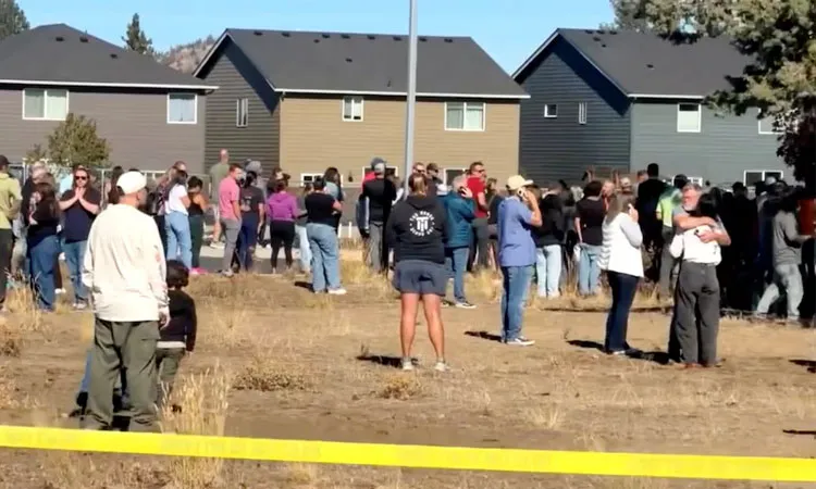 People stand near the scene of a shooting at Silver Rail Elementary School in Bend, Oregon, US