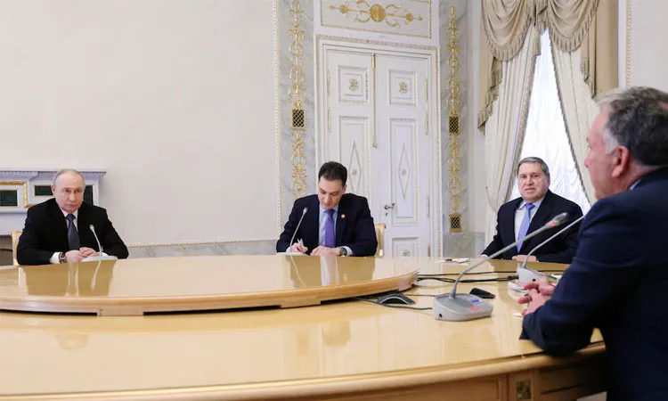Russian President Vladimir Putin and Kremlin foreign policy adviser Yuri Ushakov listen to US special envoy Steve Witkoff during a meeting at the Constantine Palace in Saint Petersburg, Russia.